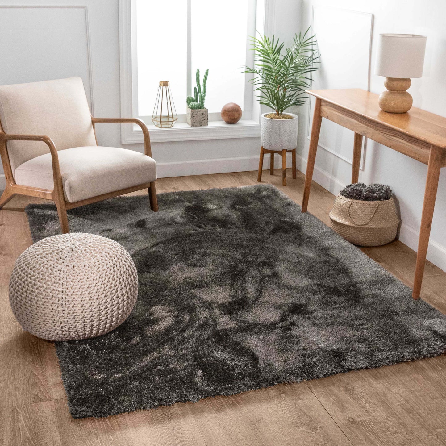 Well Woven Feather 5 x 7 (ft) Polyester Black Rectangular Indoor Solid Mid-Century Modern Spot Clean Only Pet Friendly Area rug