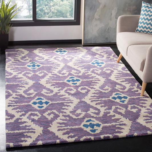 Safavieh Wyndham Ince 8 x 10 (ft) Tufted Wool Lavander/Ivory Rectangular Indoor Ikat Bohemian/Eclectic Spot Clean Only Area rug
