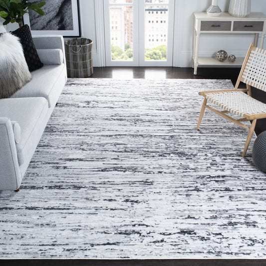 Safavieh Amelia 700 9 x 12 (ft) Loomed Polypropylene Light Gray/Charcoal Rectangular Indoor Abstract Mid-Century Modern Professionally Clean Only Area rug