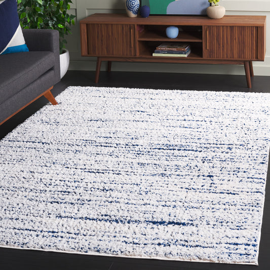 Safavieh Rumi Shag 8 x 10 (ft) Loomed Polyester Navy/Ivory Rectangular Indoor Solid Spot Clean Only Area rug